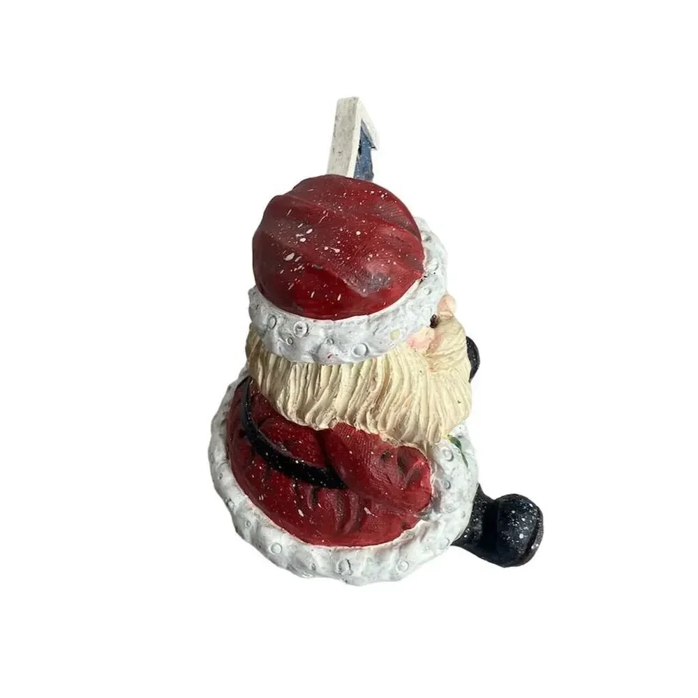 A Berry Merry Christmas Santa Claus Figurine 3